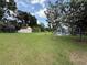 Expansive backyard with a shed, offers plenty of space for outdoor activities and storage at 13400 10Th St, Dade City, FL 33525