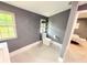 Contemporary bathroom with a sleek toilet, open shelving, and natural light at 13400 10Th St, Dade City, FL 33525