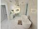 Elegant bathroom featuring a modern freestanding tub, chandelier, and marble accents at 13400 10Th St, Dade City, FL 33525