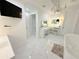 Lavish bathroom with crystal chandelier, vanity area, and sleek, modern design at 13400 10Th St, Dade City, FL 33525