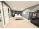 Comfortable bedroom with gray walls, a cozy bed, and a seating area, creating a welcoming space at 13400 10Th St, Dade City, FL 33525