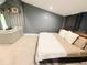 Cozy bedroom with neutral carpet, a comfortable bed, and a seating area, perfect for relaxation at 13400 10Th St, Dade City, FL 33525