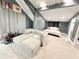 Spacious bedroom featuring a cozy sitting area and comfortable bed at 13400 10Th St, Dade City, FL 33525