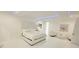Elegant bedroom featuring a plush headboard, white bedding, and modern accents at 13400 10Th St, Dade City, FL 33525