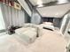 Bright bedroom with plush carpets, gray walls, and unique decorations at 13400 10Th St, Dade City, FL 33525
