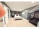 Inviting bedroom with gray walls, a comfortable bed, and a cozy seating area, perfect for relaxation at 13400 10Th St, Dade City, FL 33525