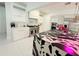 Modern kitchen with white cabinets, stainless steel appliances, and a striking island design at 13400 10Th St, Dade City, FL 33525