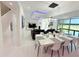 Open-concept living space with modern decor, dining area, and plenty of natural light at 13400 10Th St, Dade City, FL 33525