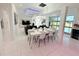 Bright, open concept living space with a dining table, sofa, and modern decor at 13400 10Th St, Dade City, FL 33525