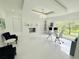 Stylish home office with fireplace, glass desk, and serene outdoor views at 13400 10Th St, Dade City, FL 33525