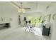 This bright office with glass desk offers a tranquil work environment at 13400 10Th St, Dade City, FL 33525