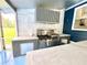 This outdoor kitchen is fully equipped with stainless steel appliances, perfect for grilling and entertaining at 13400 10Th St, Dade City, FL 33525