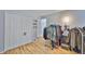 Well-organized closet with wood floors, double doors and hanging space at 13750 Fareham Rd, Odessa, FL 33556