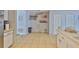Spacious kitchen with ample counter space, modern appliances, and views into the common areas at 13750 Fareham Rd, Odessa, FL 33556