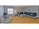Spacious living room with hardwood floors and a large window that provides natural light at 13750 Fareham Rd, Odessa, FL 33556