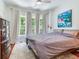 Tranquil bedroom featuring ample natural light from large windows and stylish decor at 1423 Dr Martin Luther King Jr N St, St Petersburg, FL 33704
