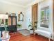 Charming foyer with a window bench, decorative mirror, and hardwood flooring at 1423 Dr Martin Luther King Jr N St, St Petersburg, FL 33704