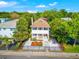 Charming two-story home featuring a well-manicured front yard and inviting porch at 1423 Dr Martin Luther King Jr N St, St Petersburg, FL 33704