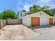 Three-car garage provides ample parking and storage space, complemented by a spacious driveway at 1423 Dr Martin Luther King Jr N St, St Petersburg, FL 33704