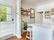 Modern kitchen featuring an island with seating and convenient access to the exterior door at 1423 Dr Martin Luther King Jr N St, St Petersburg, FL 33704