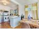 Bright kitchen with wood floors, dining table, and stainless steel refrigerator at 1423 Dr Martin Luther King Jr N St, St Petersburg, FL 33704