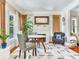 Cozy living room with a fireplace, hardwood floors, and comfortable seating at 1423 Dr Martin Luther King Jr N St, St Petersburg, FL 33704