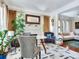 Cozy living room with a fireplace, hardwood floors, and comfortable seating at 1423 Dr Martin Luther King Jr N St, St Petersburg, FL 33704