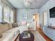 Comfortable living room with ample seating and hardwood floors at 1423 Dr Martin Luther King Jr N St, St Petersburg, FL 33704