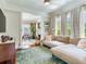 Comfortable living room with a large sectional sofa and lots of natural light at 1423 Dr Martin Luther King Jr N St, St Petersburg, FL 33704