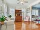Inviting living room with hardwood floors, comfortable furniture, and natural light at 1423 Dr Martin Luther King Jr N St, St Petersburg, FL 33704