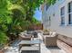 Outdoor patio with comfortable seating and a fire pit, creating a cozy space for entertaining at 1423 Dr Martin Luther King Jr N St, St Petersburg, FL 33704
