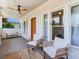 Inviting front porch with seating area featuring comfortable chairs and a small table for relaxing at 1423 Dr Martin Luther King Jr N St, St Petersburg, FL 33704