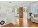 Upstairs landing with hardwood floors, neutral tones, and access to a balcony at 1423 Dr Martin Luther King Jr N St, St Petersburg, FL 33704