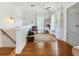 Bright upstairs landing with hardwood floors and access to other rooms at 1423 Dr Martin Luther King Jr N St, St Petersburg, FL 33704