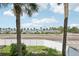 Breathtaking beach view from the property, showcasing palm trees and clear skies at 14401 Gulf Blvd # 106, Madeira Beach, FL 33708