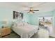 Inviting bedroom boasting a balcony with ocean views, comfortable bed, and neutral color palette at 14401 Gulf Blvd # 106, Madeira Beach, FL 33708