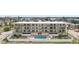 Charming exterior with a pool, well-maintained landscaping, and ample balcony space at 14401 Gulf Blvd # 106, Madeira Beach, FL 33708