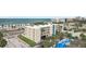 Exterior shot of the property with well-maintained parking and landscaping near the beach at 14401 Gulf Blvd # 106, Madeira Beach, FL 33708