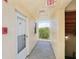 Hallway view leading to the unit with a view of the outside at 14401 Gulf Blvd # 106, Madeira Beach, FL 33708