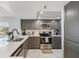 Beautiful kitchen equipped with stainless steel appliances and modern finishes at 14401 Gulf Blvd # 106, Madeira Beach, FL 33708