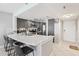 Modern kitchen featuring stylish counter seating and stainless steel appliances at 14401 Gulf Blvd # 106, Madeira Beach, FL 33708