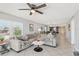 Spacious living room with views of the dining area and the open concept layout at 14401 Gulf Blvd # 106, Madeira Beach, FL 33708