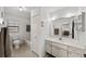 Well-lit bathroom features a clean single sink vanity and tiled shower-tub combination at 1633 Bentwood Dr, Sun City Center, FL 33573