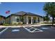 Attractive community clubhouse with accessible parking and American flag in a retirement community at 1633 Bentwood Dr, Sun City Center, FL 33573