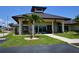 Community association offices exterior with palm trees and well-maintained landscaping at 1633 Bentwood Dr, Sun City Center, FL 33573