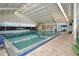 Bright indoor pool with large windows and ample seating in retirement community at 1633 Bentwood Dr, Sun City Center, FL 33573