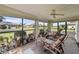 Relaxing screened lanai with comfortable seating, perfect for enjoying the outdoors at 1633 Bentwood Dr, Sun City Center, FL 33573