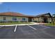 Exterior view of the community library with ample parking and well-maintained landscaping at 1633 Bentwood Dr, Sun City Center, FL 33573