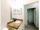 Bathroom featuring granite countertop, mirror, and tile flooring at 16431 Enclave Village Dr # 16431, Tampa, FL 33647