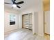 Bright bedroom with vinyl floors, a ceiling fan, and a walk-in closet at 16431 Enclave Village Dr # 16431, Tampa, FL 33647